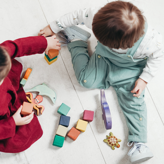 little kids playing blocks 