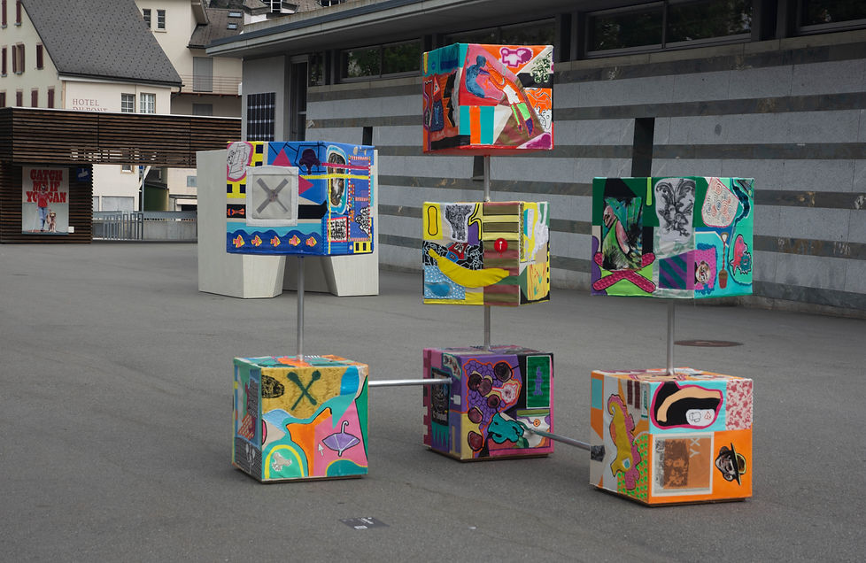 Cube3900 was made from drawings and paintings on fabric from many different people. The individual works of art were sewn together, painted on and made into 7 large cubes