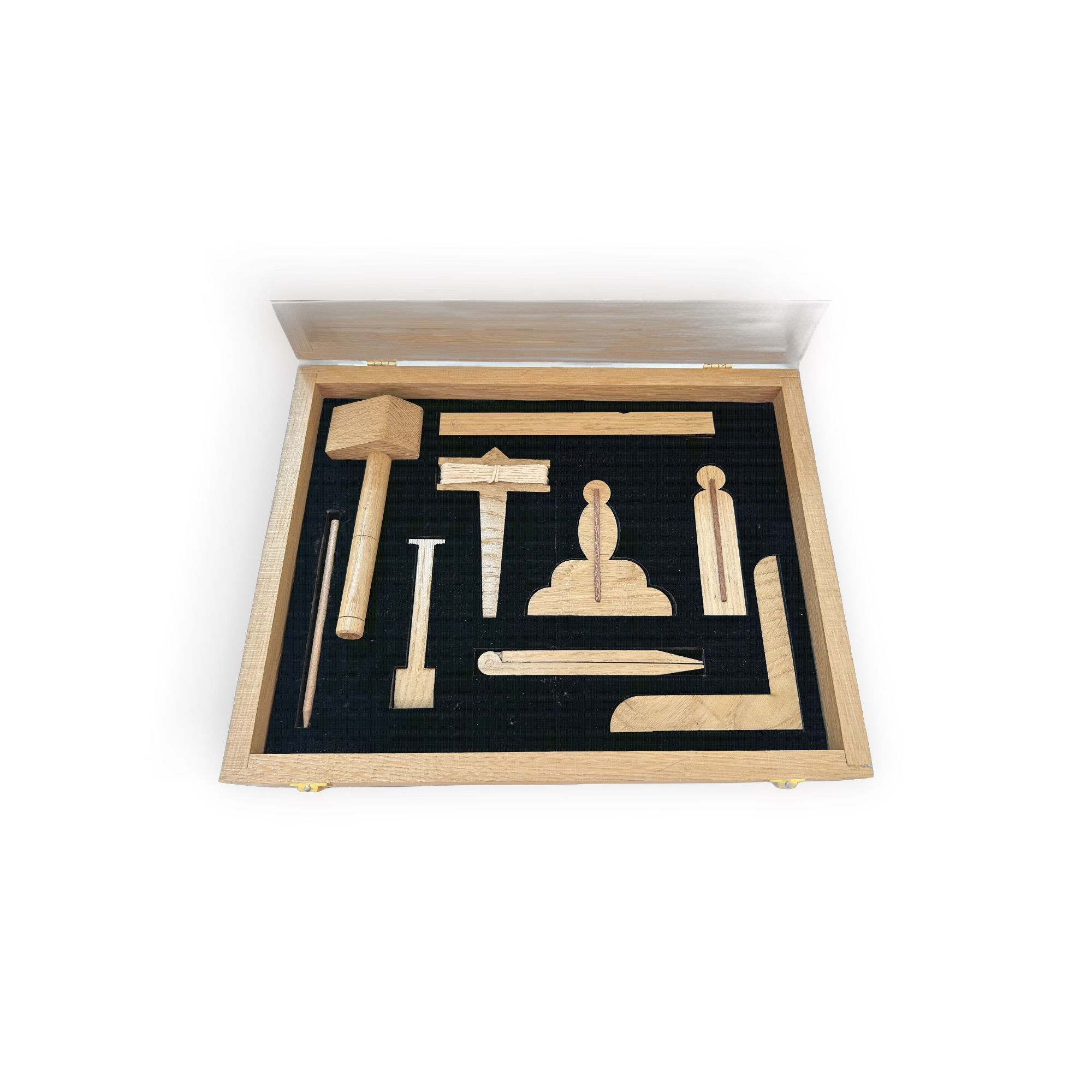 Open wooden box containing a full set of wooden working tools.