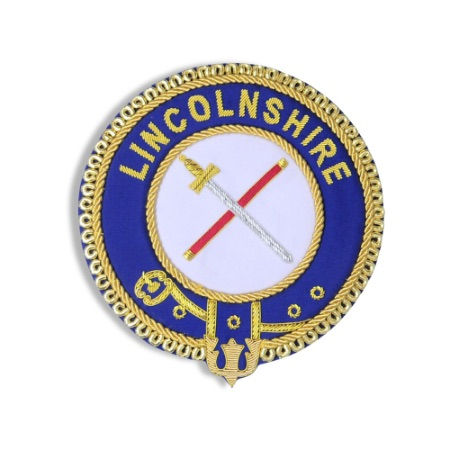 Circular apron badge with outer blue edge embroidered with name of province and central white area embroidered with rank insignia