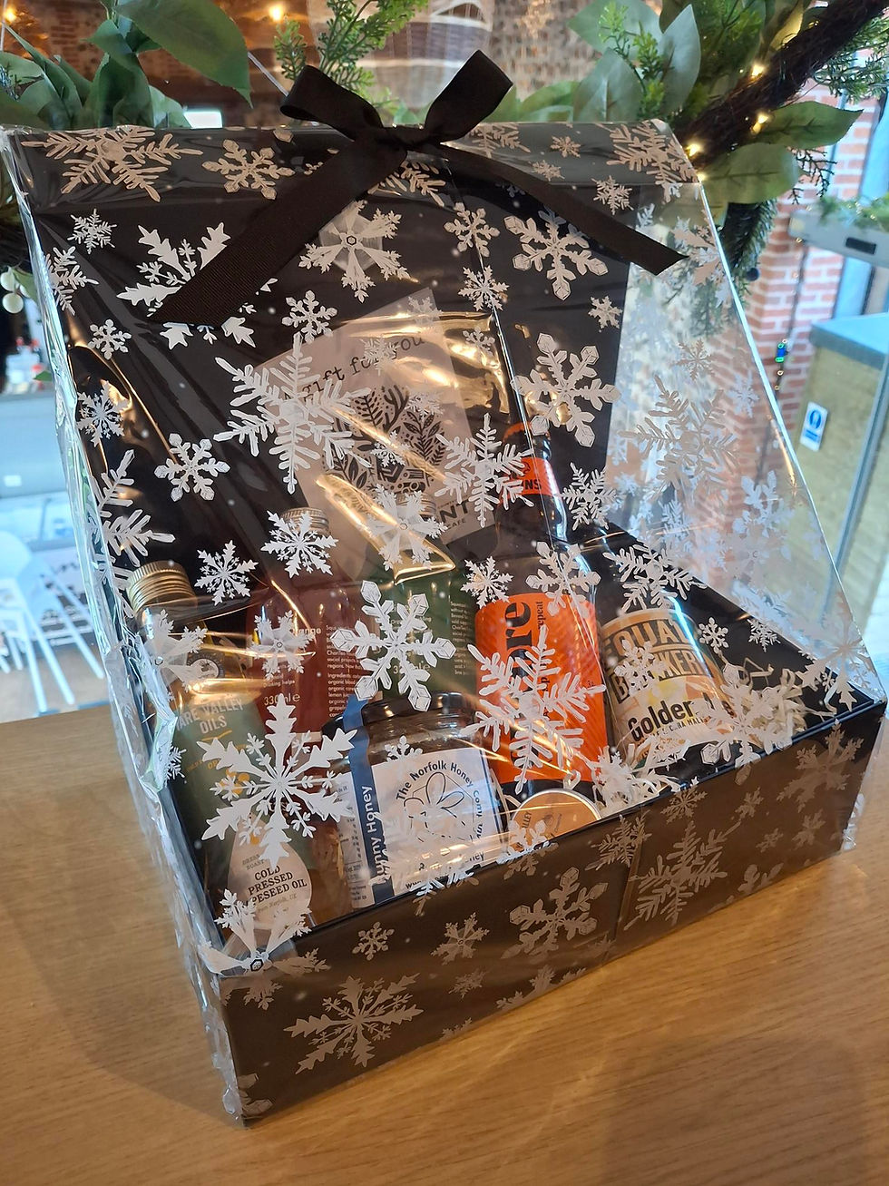 Hamper of local products wrapped in snowflake cellophane