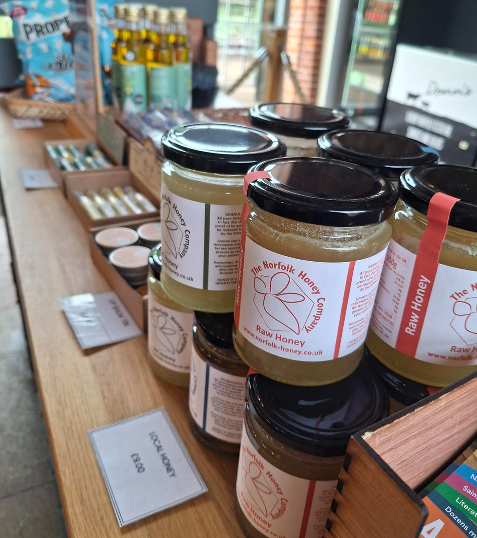 local produce including honey, lip balms and oil on the table in the Flint Barn Cafe,