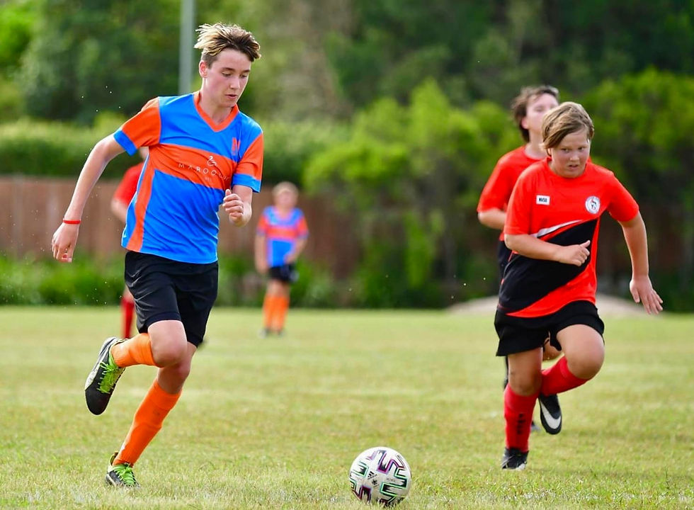 Young men playing soccer