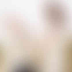 Dad and daughter hold mums baby bump on the beach during maternity photos