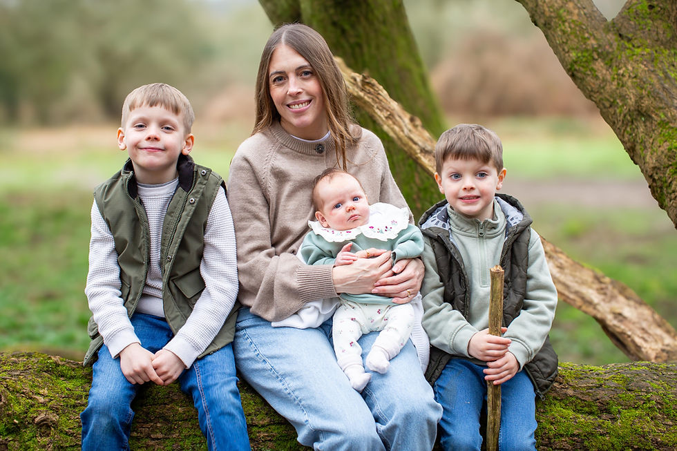 mum with three children in the woods