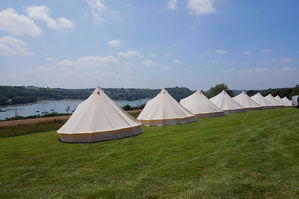 bell tents pitched for a wedding in falmouth