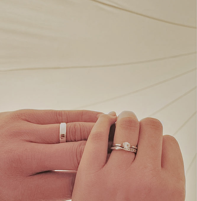 just married rings bell tent.jpg