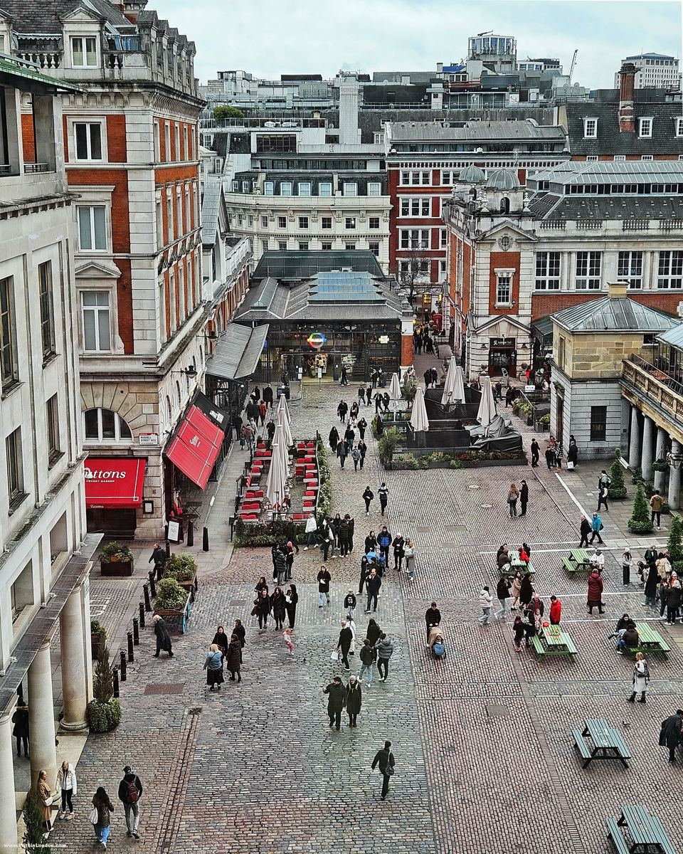 Covent Garden Piazza from the Royal Opera House terrace, with the colonnade and people crossing the cobbles