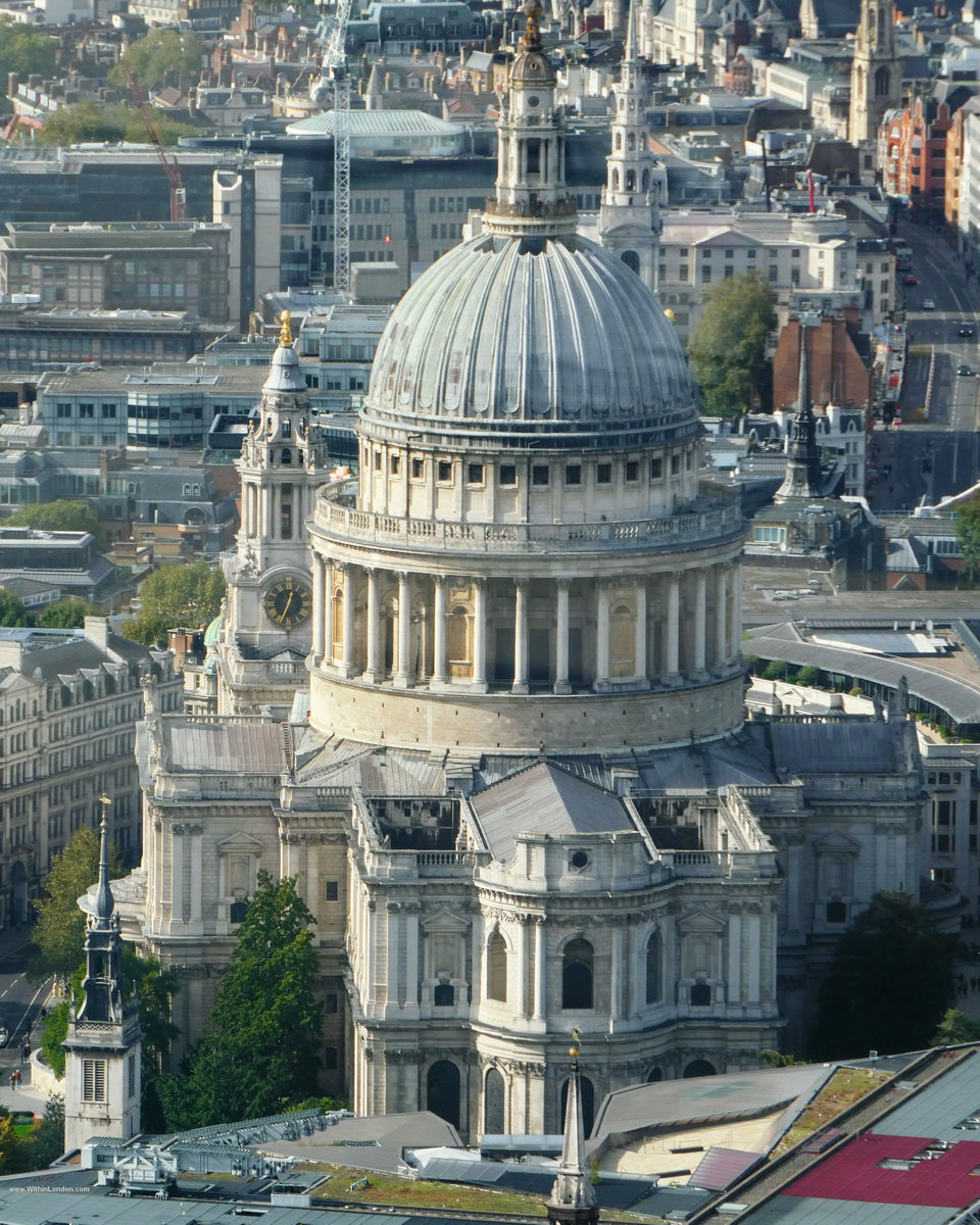 The dome of St Paul's glowing among dark office towers at sunset, looking down from 8 Bishopsgate