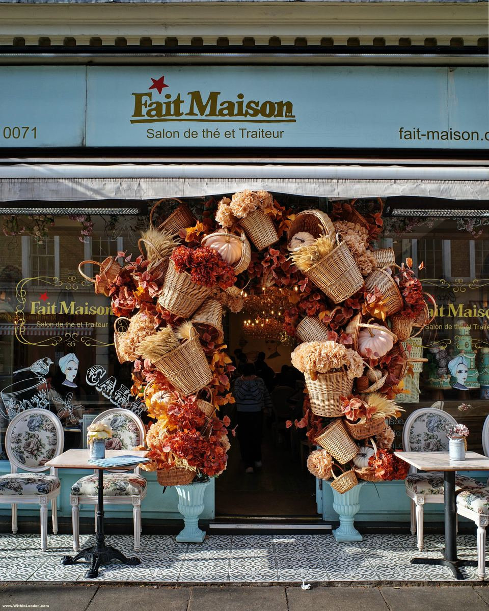 Fait Maison on Gloucester Road with its awning framed by a display of wicker baskets, dried flowers and copper-coloured foliage