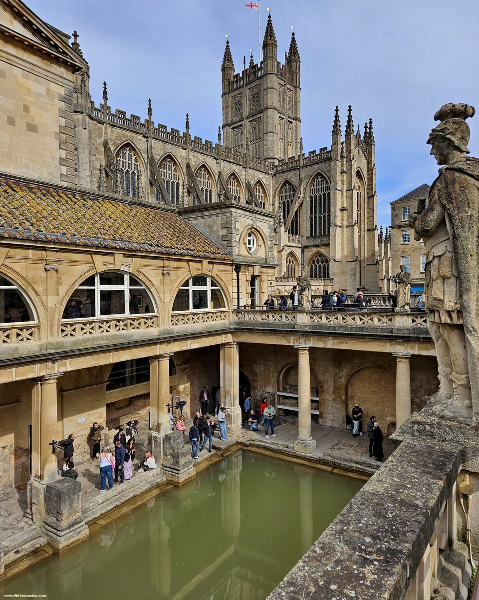The Great Bath at the Roman Baths with green spring water and the Victorian colonnade, Bath