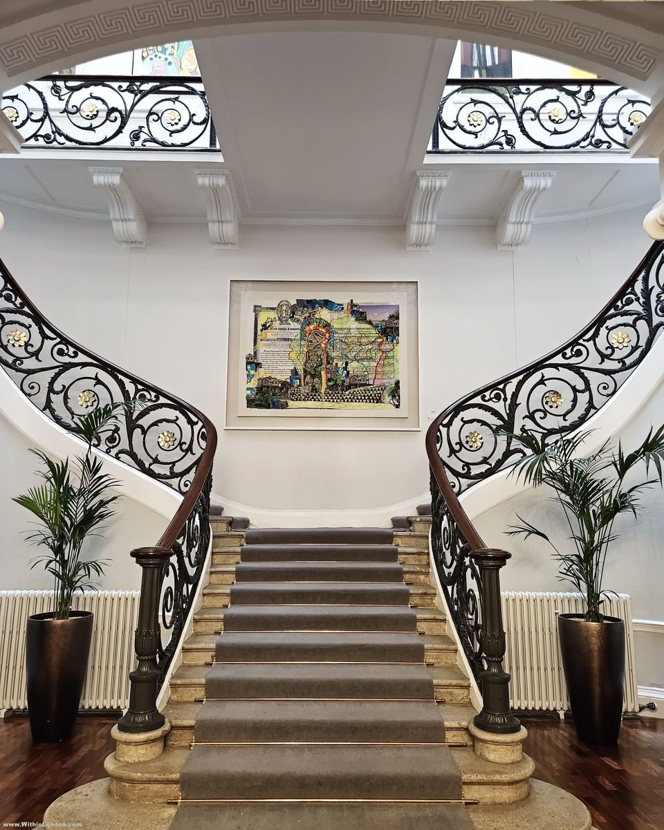 A double staircase splitting into two flights inside a Nash terrace house