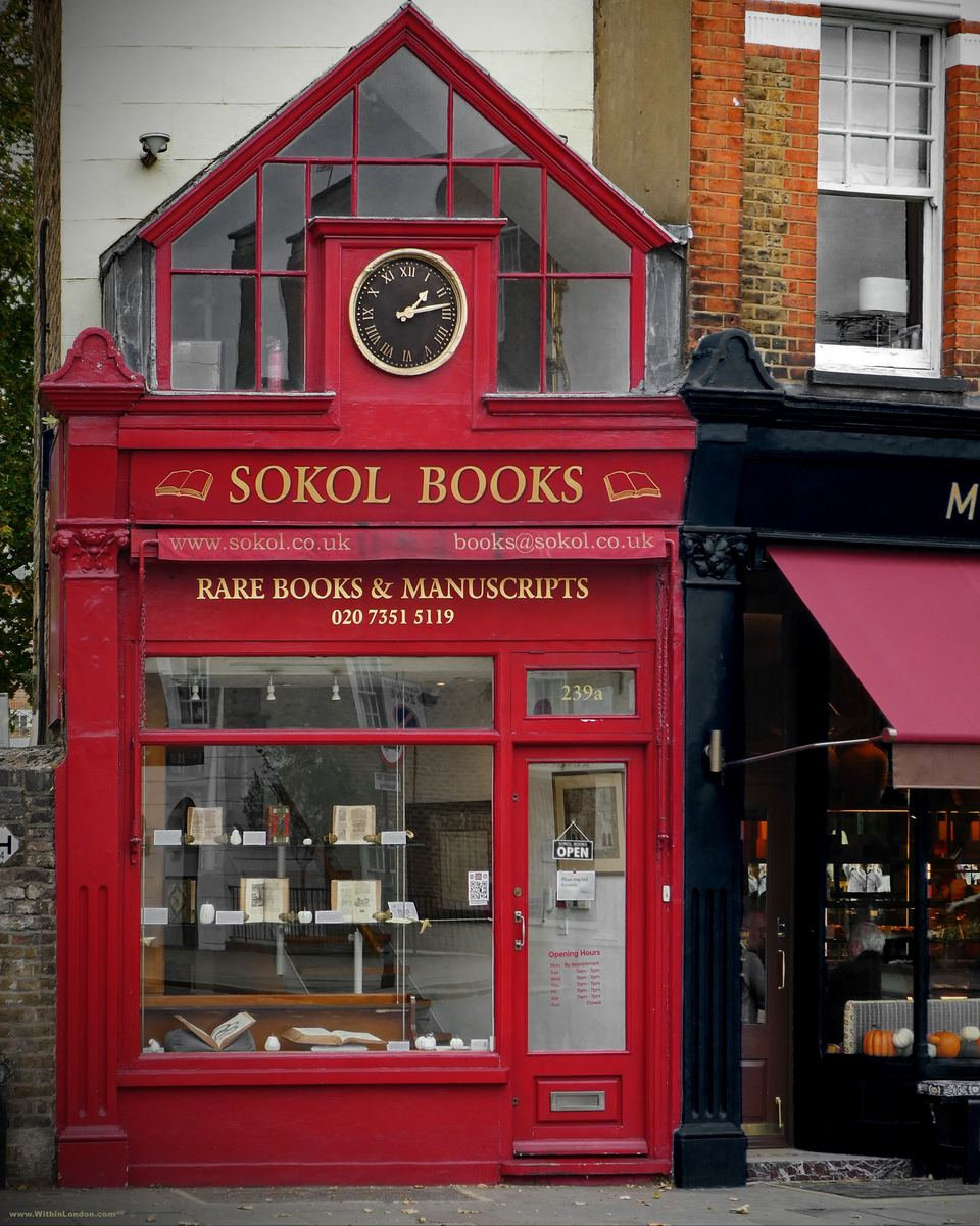 Sokol Books on Fulham Road, a narrow shopfront painted red with a clock in the gable and rare books in the window
