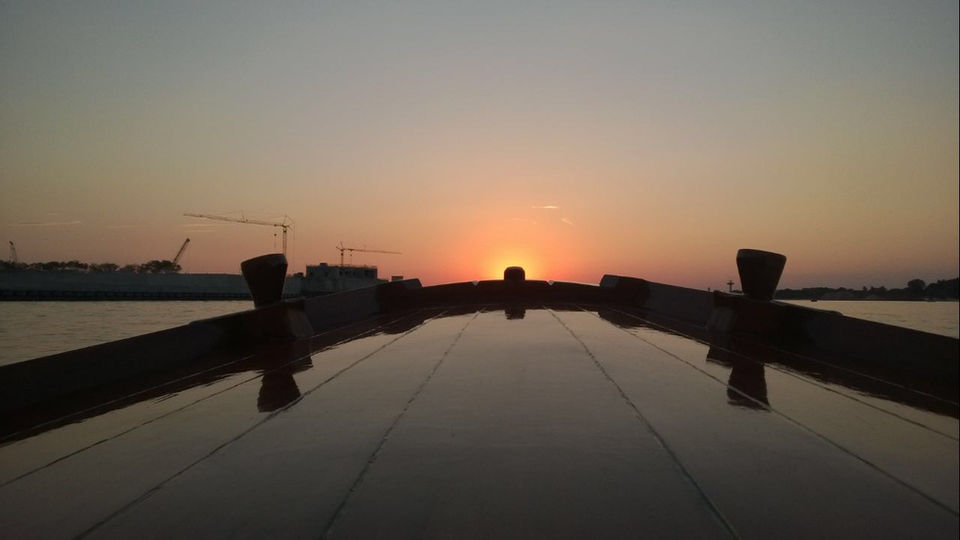 A boat heading into the sunset in Venice Italy
