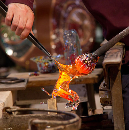 Skilled glassmith making a horse out of glass at Murano Italy