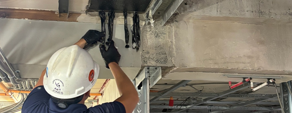 Crew member installing carbon fiber splayed anchor