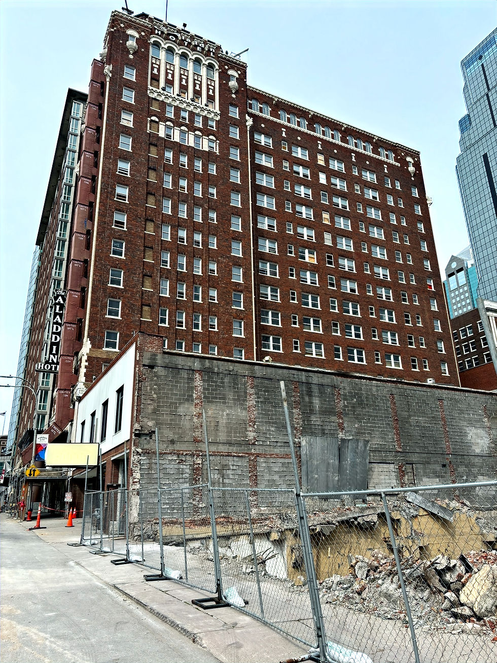 Historic Aladdin Hotel in downtown Kansas City under renovation, showing exterior construction work as part of Molzer Developments’ apartment conversion with structural reinforcement by SRS