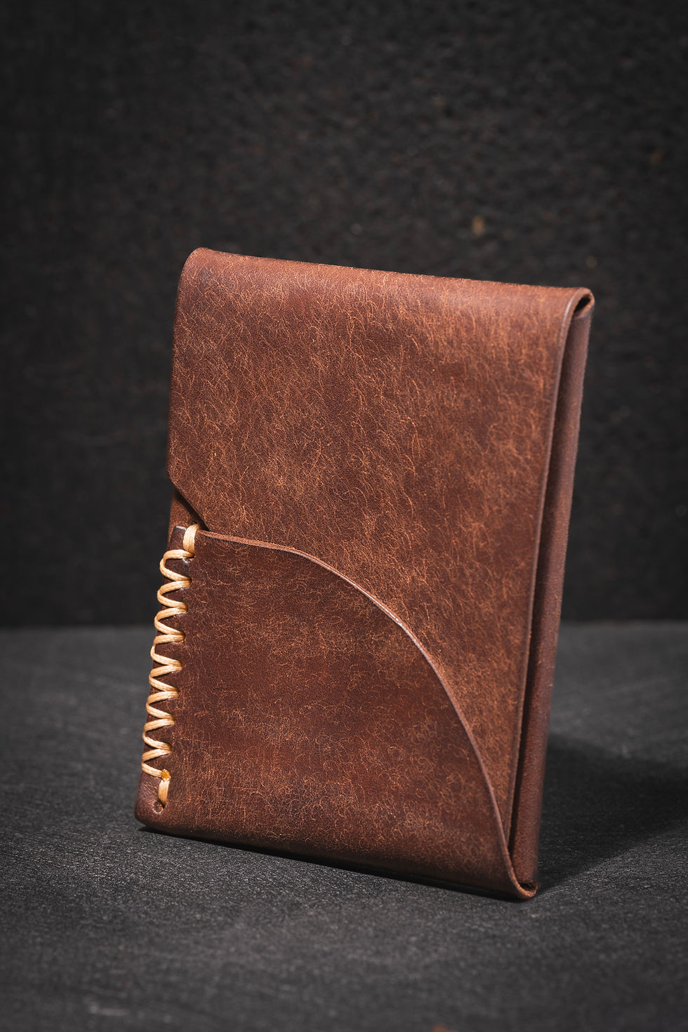 Thumbnail: Brown leather cardholder with side stitching