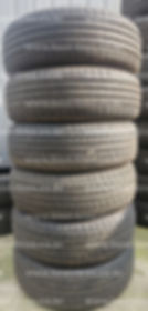 Tall stack of used car tires