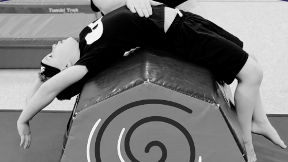 Eye-level view of a young boy practicing ninja skills on a balance beam