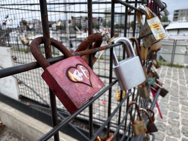 Padlocks of Meaning by the river in Antwerp - Who put them there? How long ago? What do is there story?