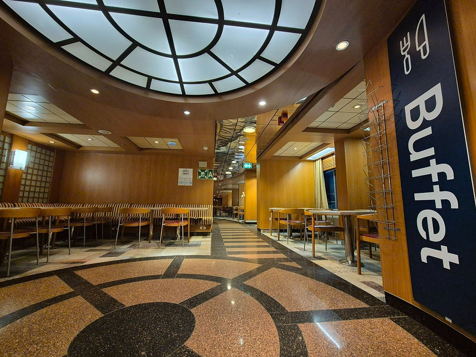 Empty buffet restaurant on Hibernia Line ferry with wood-panelled walls, patterned floor, and a large vertical Buffet sign; warm, quiet mood.