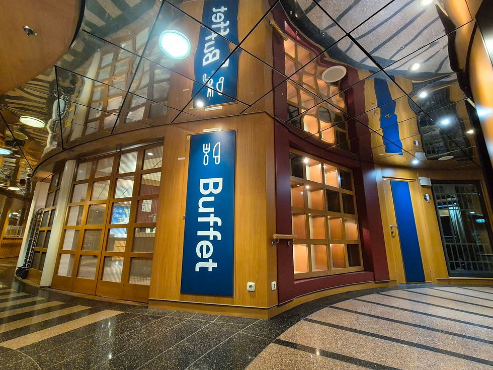 Empty Hibernia Line buffet restaurant interior with mirrored ceiling, blue Buffet signs, wood-panelled walls, and warm lights.