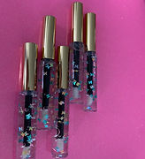 Butterfly lip gloss goes on smooth and smell like berries