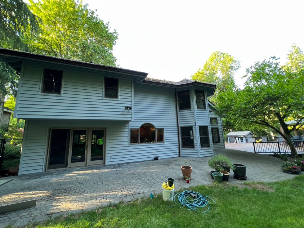 Modern gray and white exterior paint finish on a large residential home in Lake Oswego, Oregon, featuring professional detailing and premium coatingProfessional exterior painting of a large Lake Oswego estate featuring a modern gray and white color palette with premium weather-protective coatings by Amazing Painting & Renovation.
