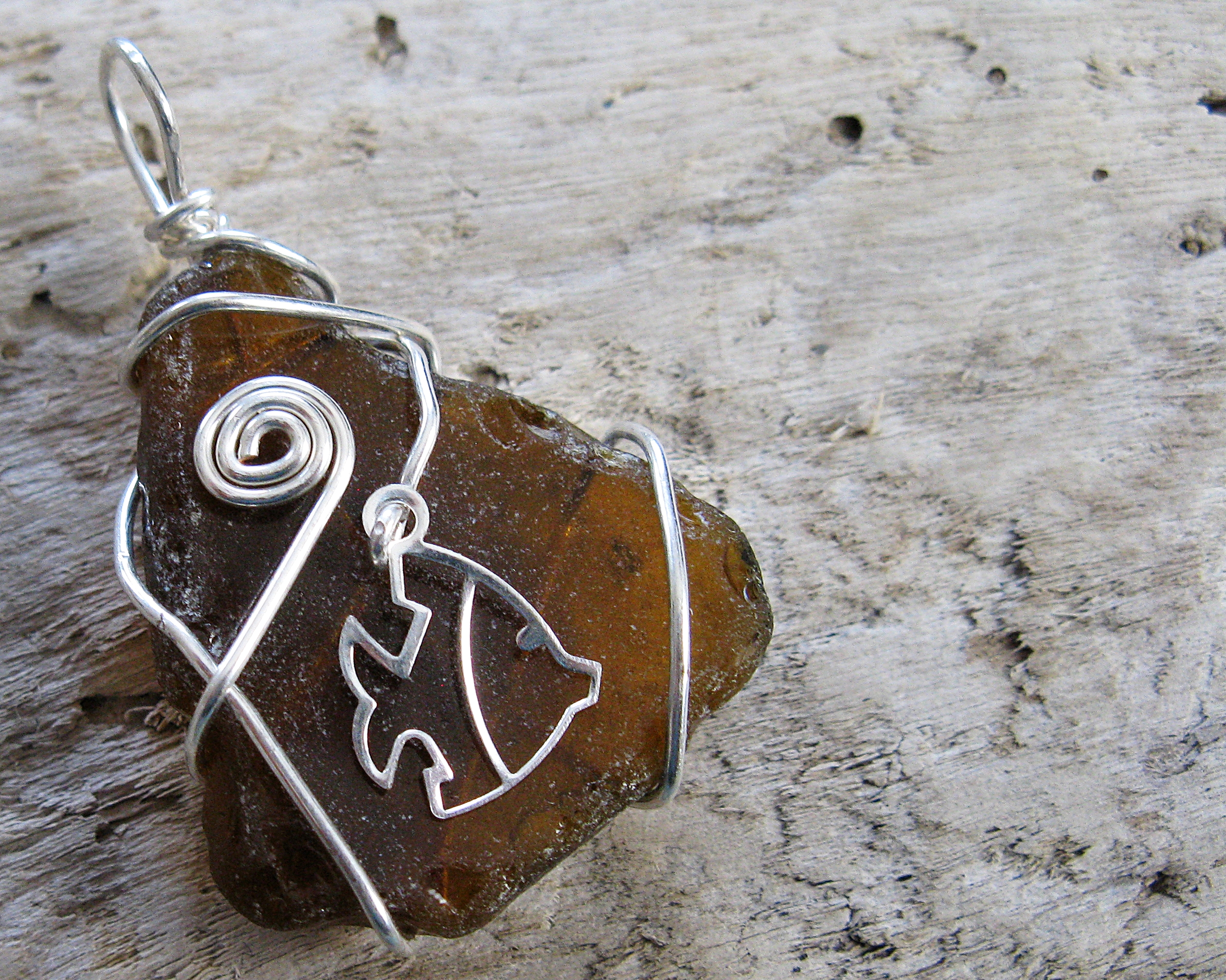 090 silver freeform with fish outline on brown 1