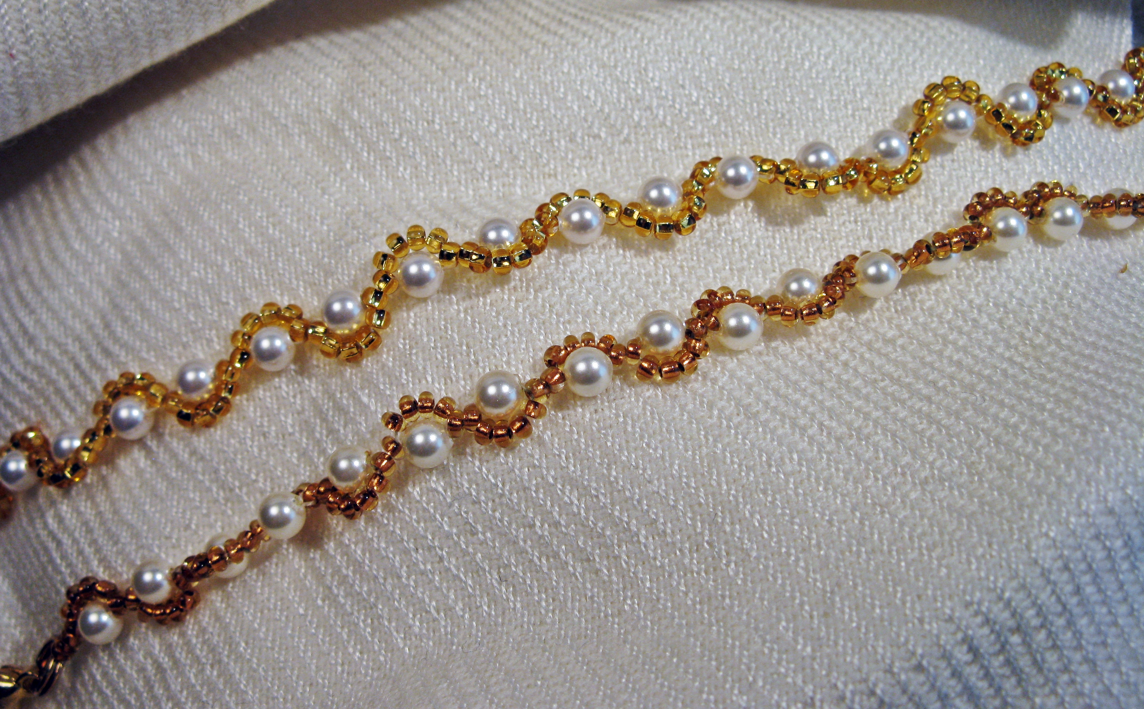 Gold and white pearl bracelets