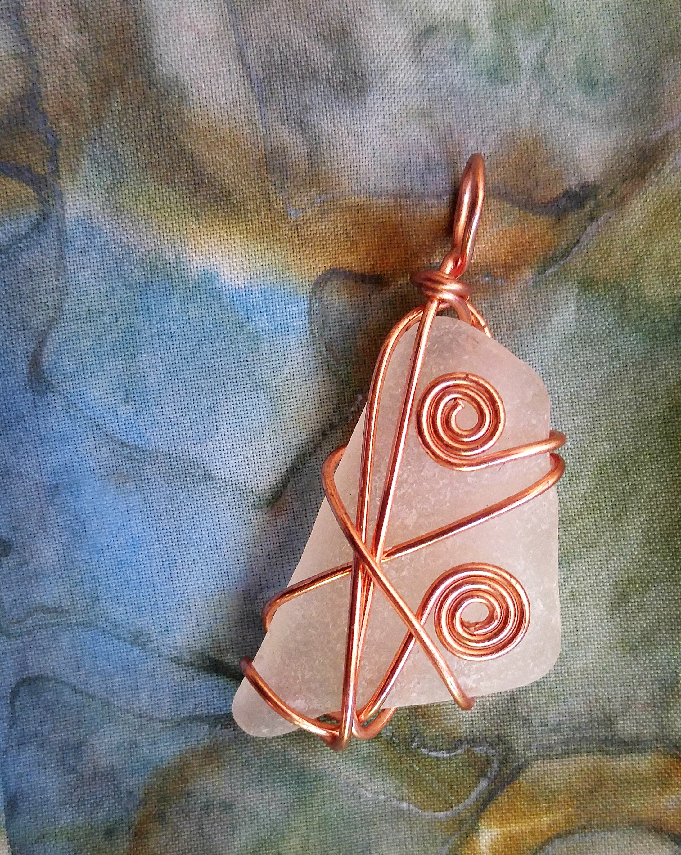 Copper swirls and star pendant