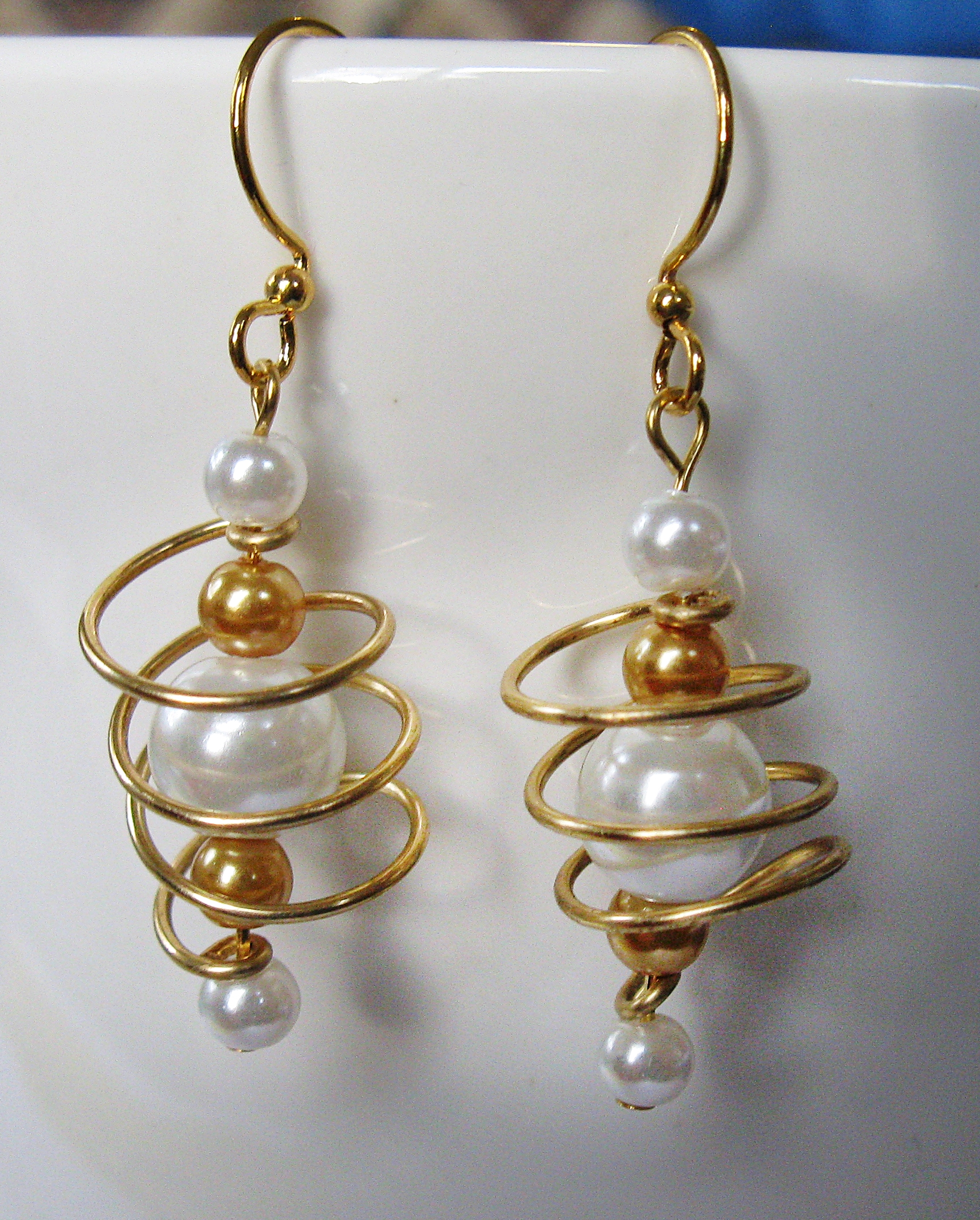 Brass, white, and caramel coils