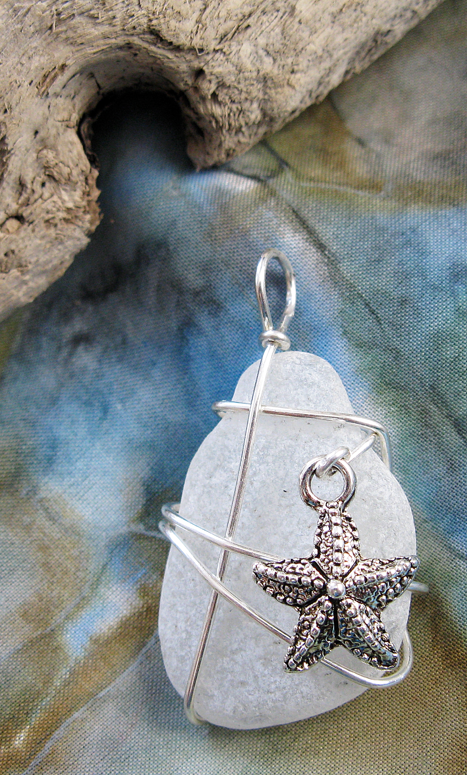 092 silver freeform with textured small starfish on white 1