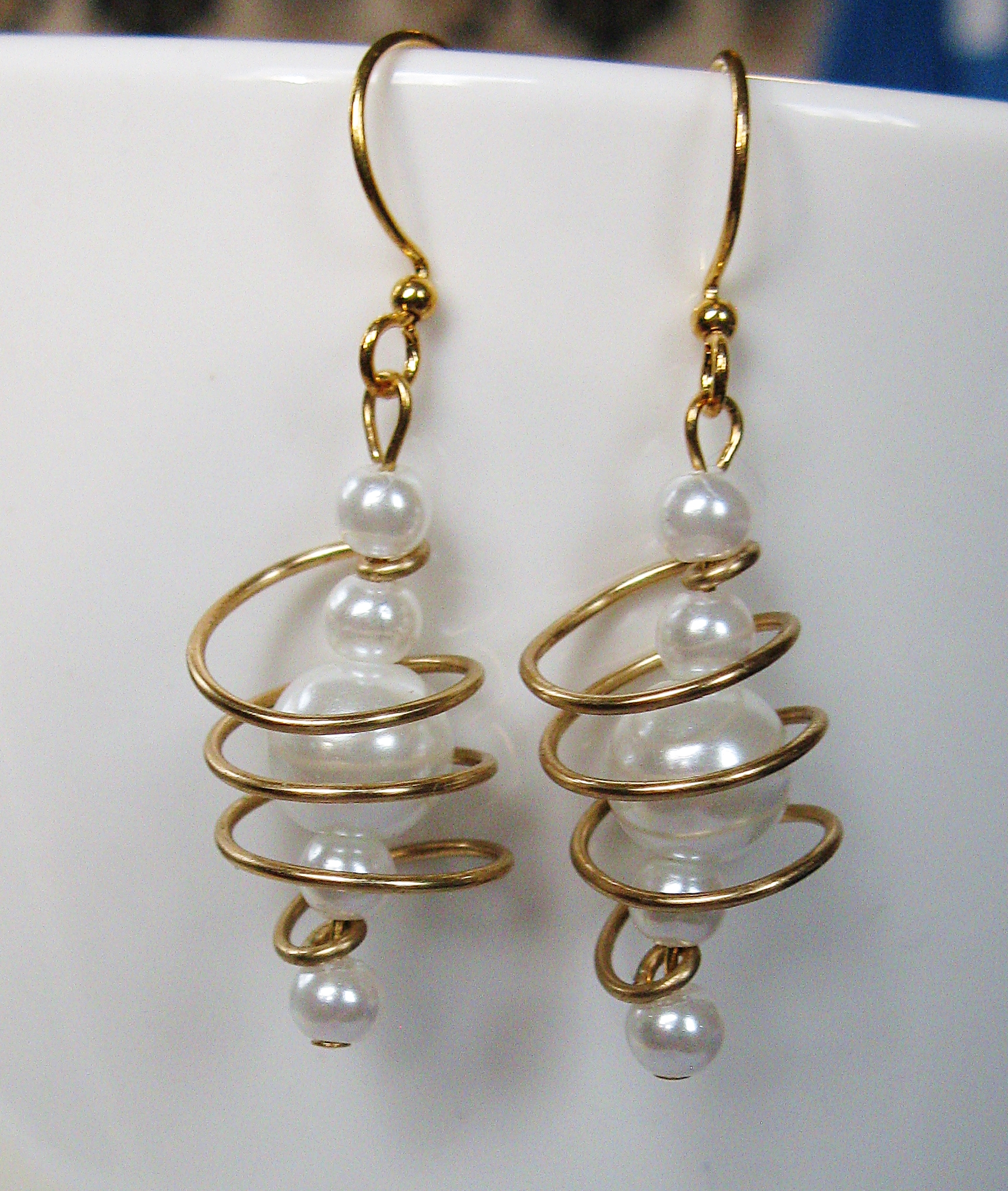 Brass and white freeform coils