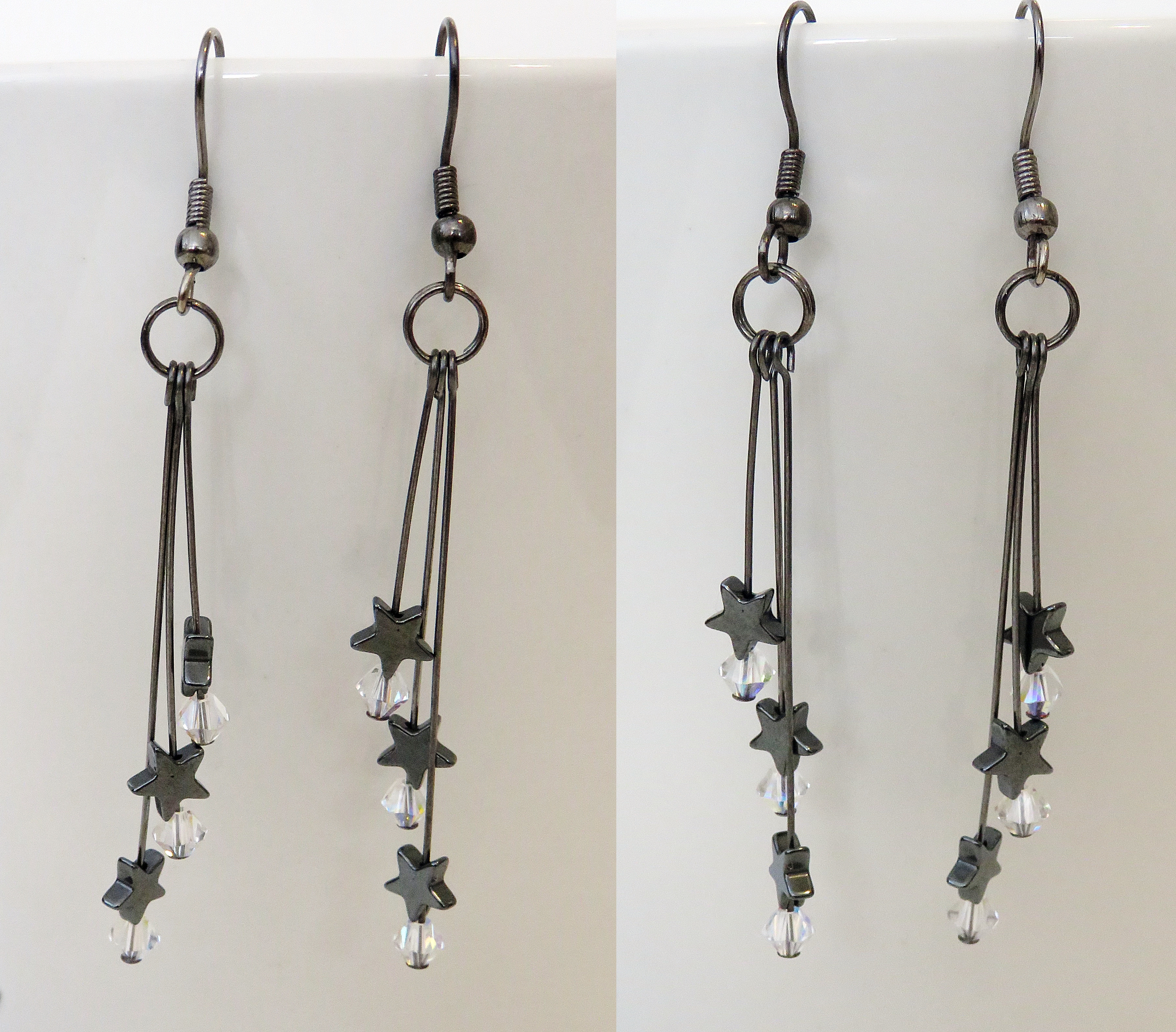 Dark shooting star drop earrings
