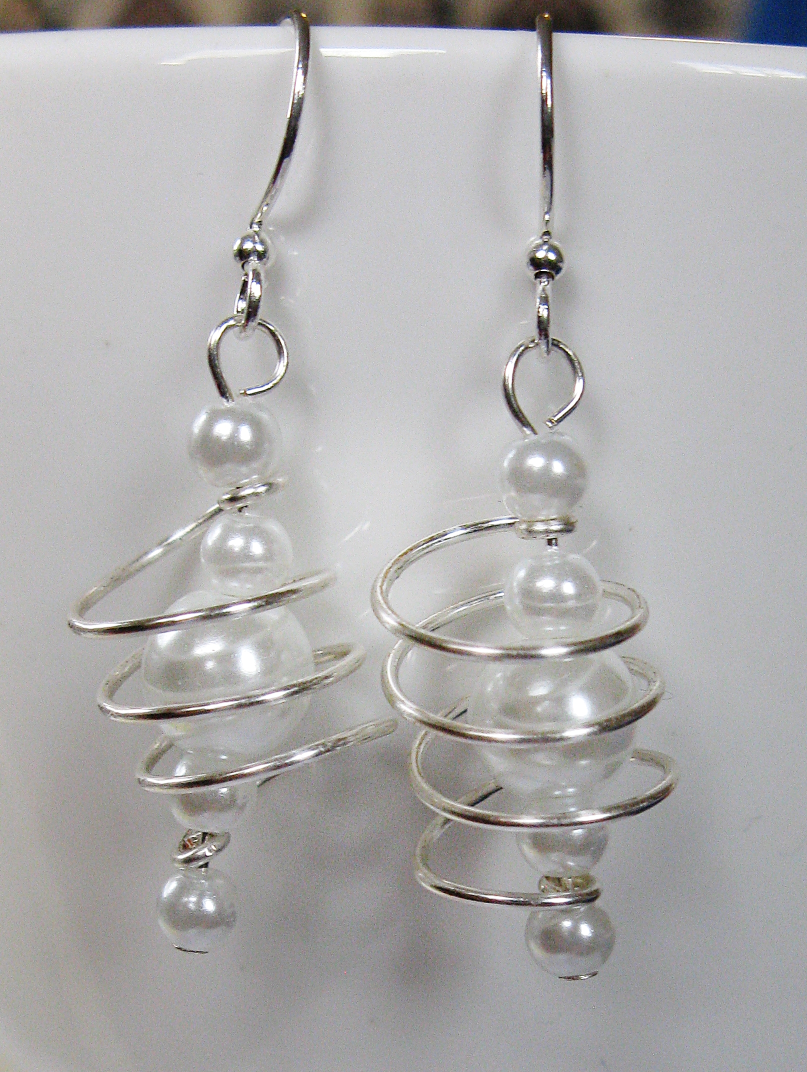 Silver and white freeform coils