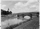 Footbridge across Lake Sacajawea to Lions Island with R.A.Long H.S. in background. 1928.jp