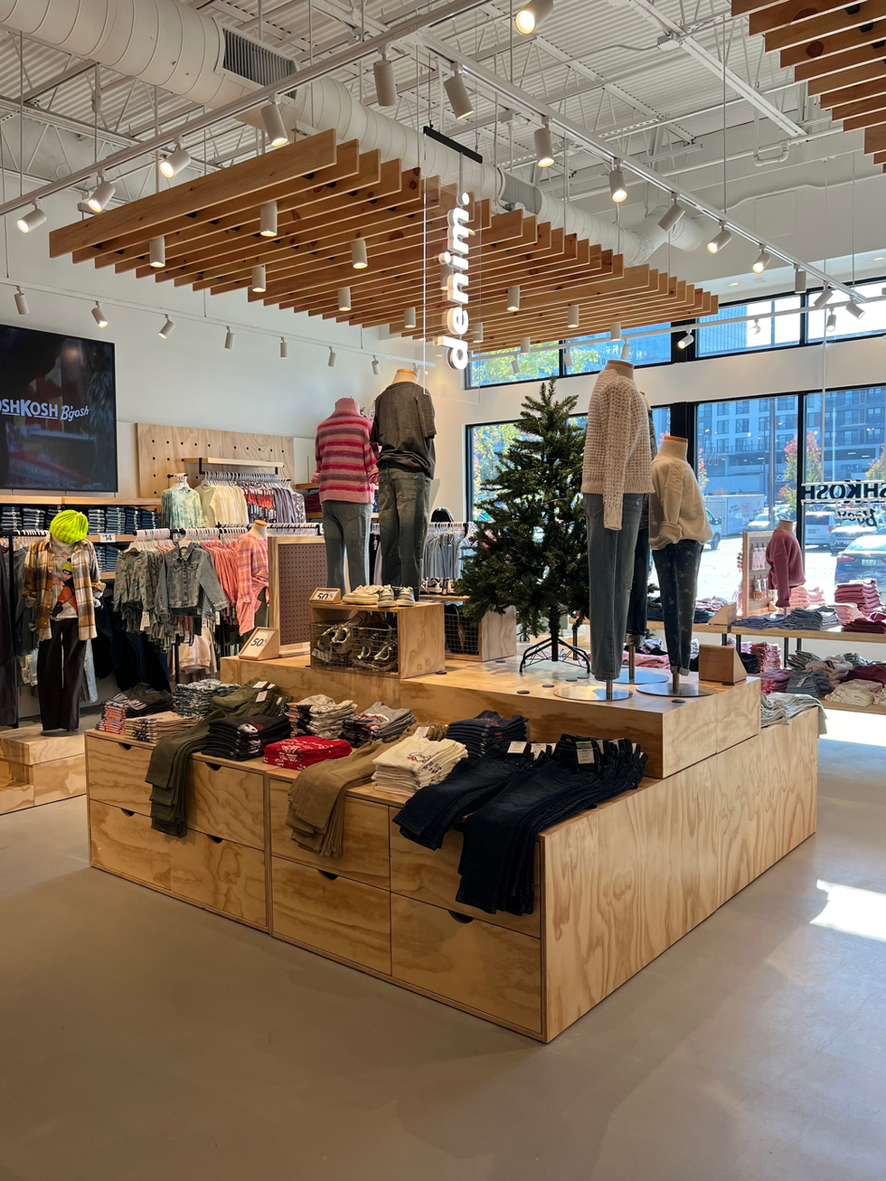 a store with a denim sign hanging from the ceiling