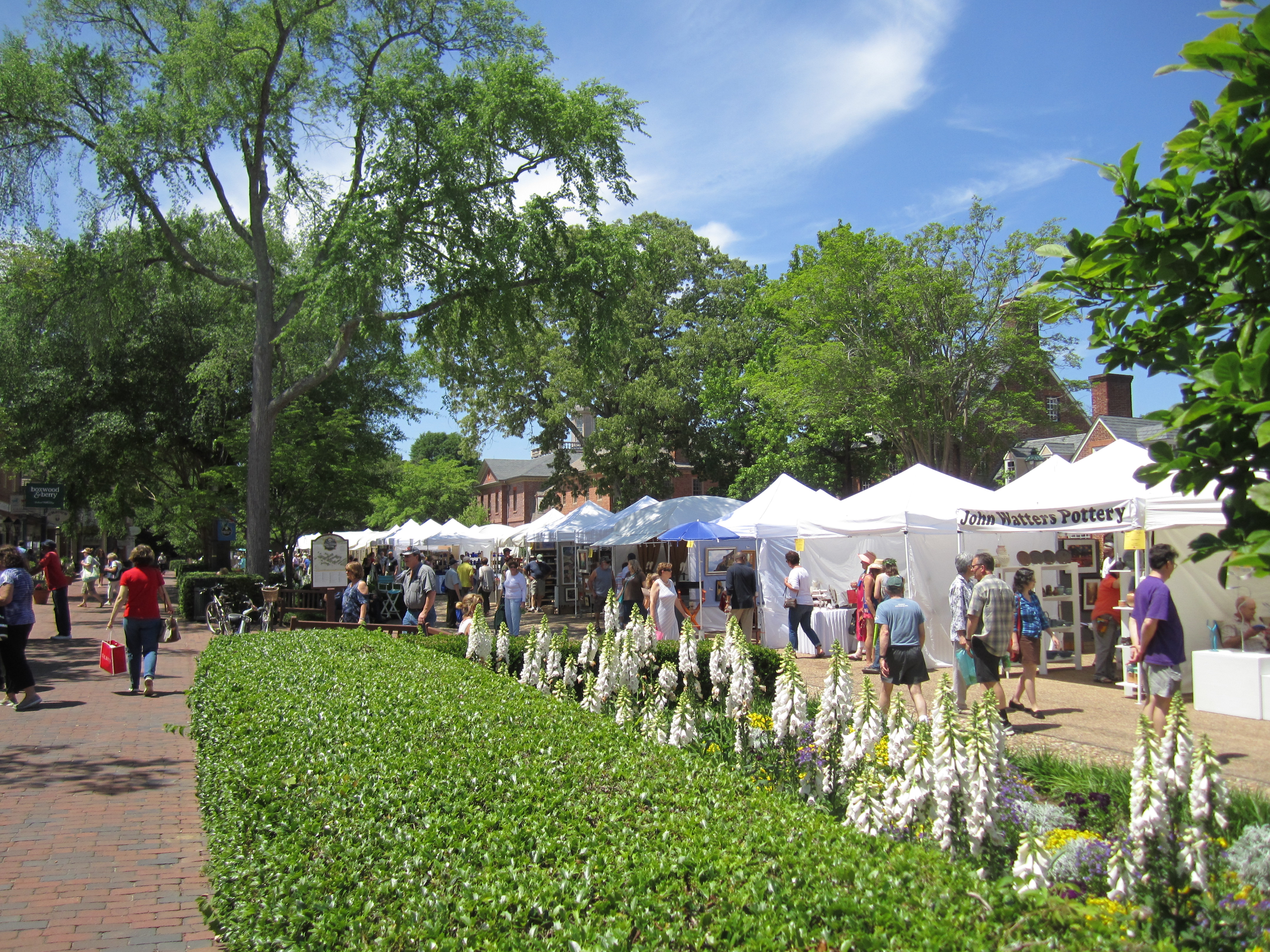 Attendees stroll along North Boundary Street and Duke of Gloucester Street in Merchants Square