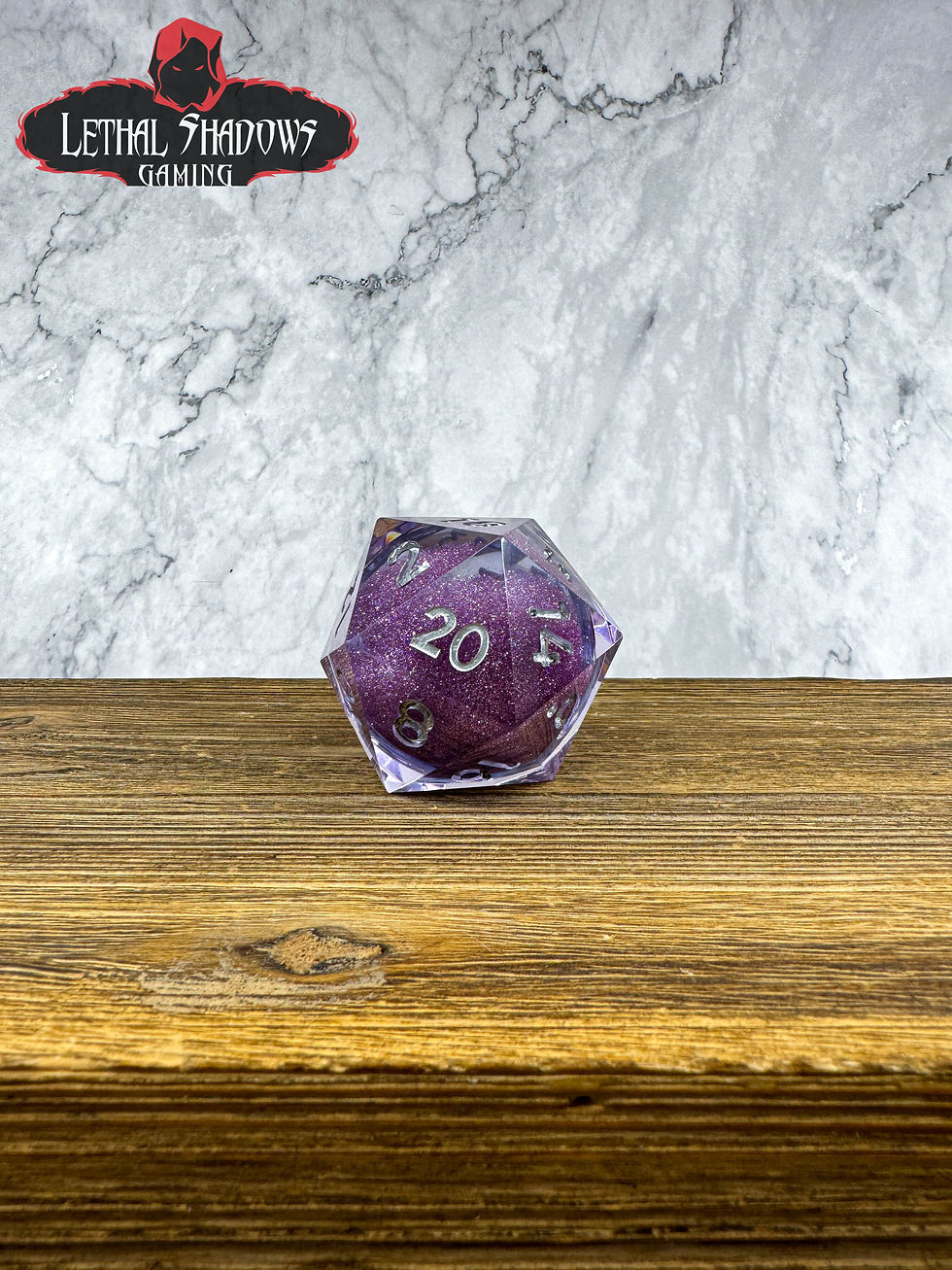 Purple translucent d20 showing 20