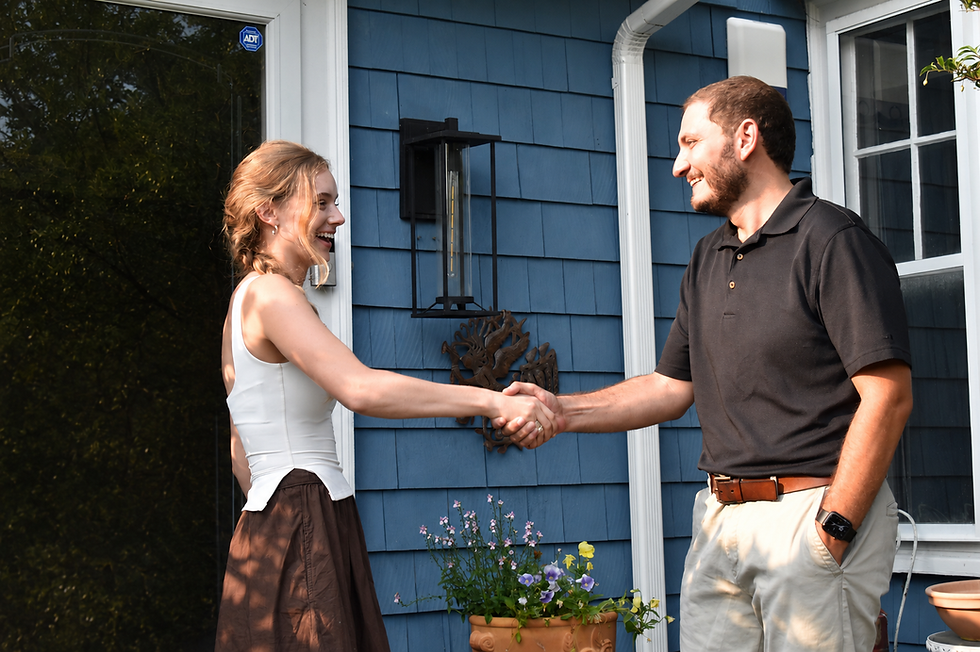 Zak and Female Voter Shaking Hands