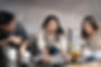 Three friends having fun while playing poker game