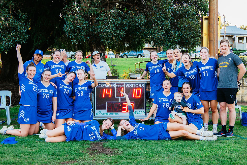 The Women's team celebrates after winning the grand final