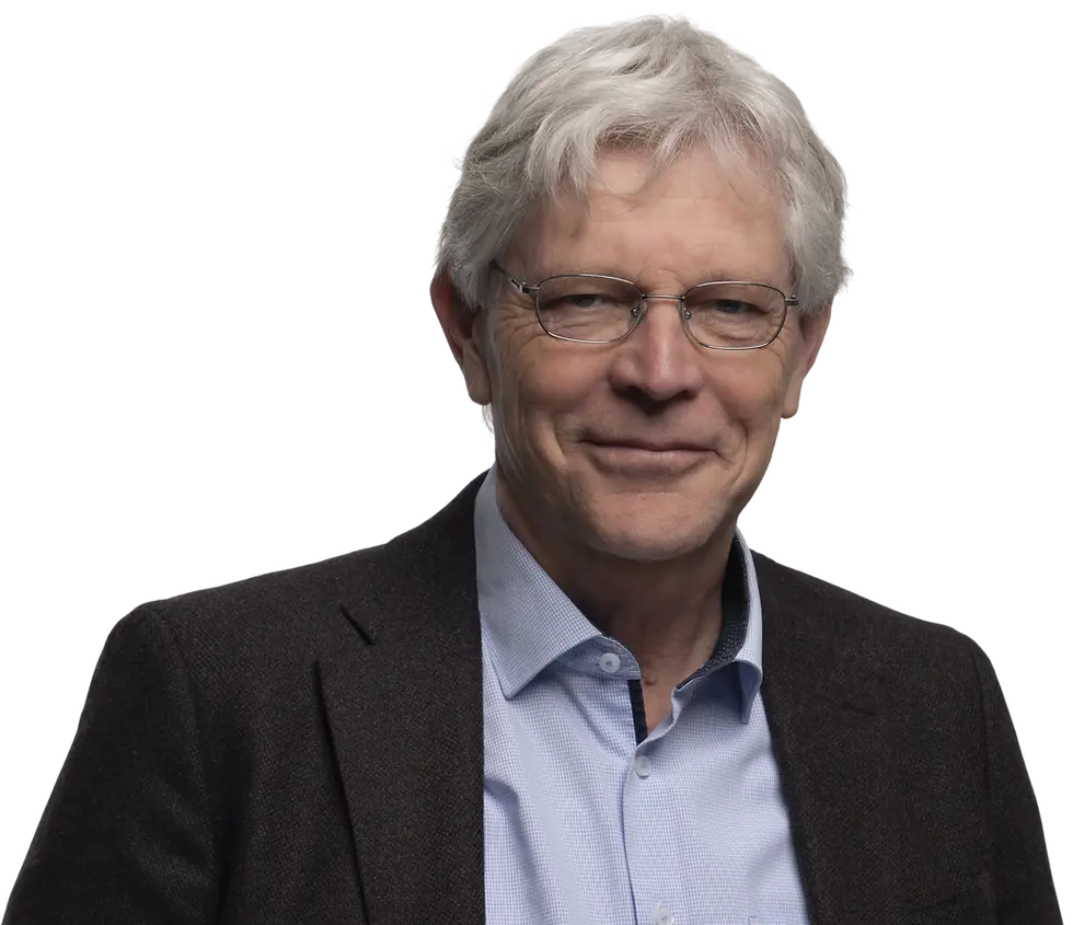 Studio photography, headshot of a mature businessman with grey hair and glasses. Professional and approachable demeanor against a black background.