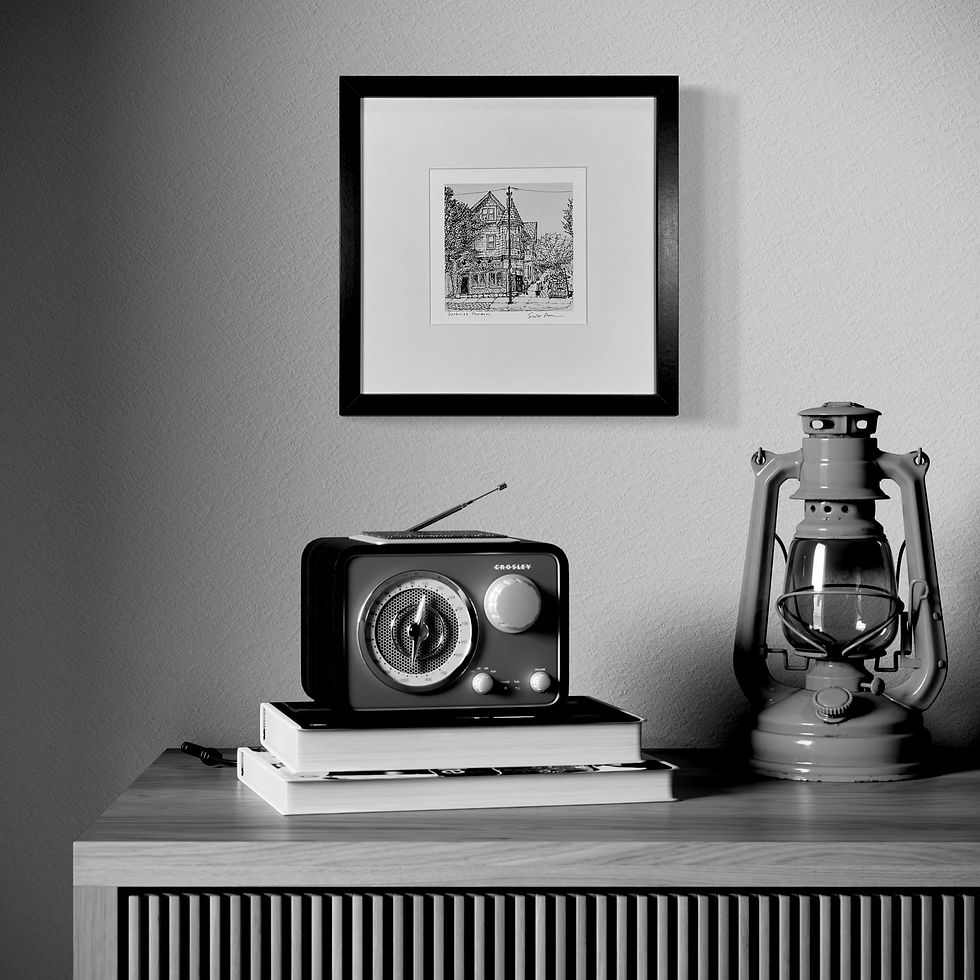 Thumbnail: Guthries framed hand-drawn art hanging in a den