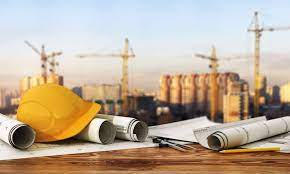 Image of a hard hat on drafting desk