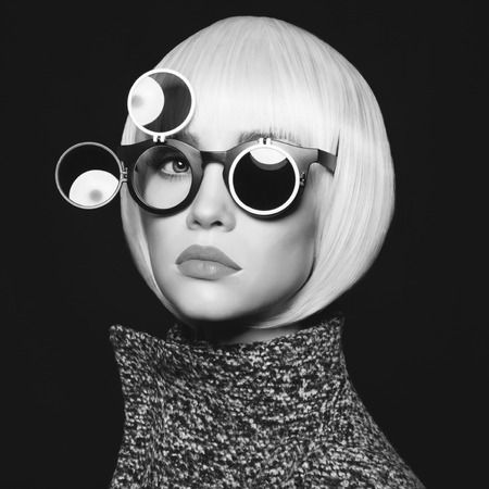 DressYourMind Eyewear black round framed retro sunglasses on an elegant female fashion model with white blonde hairs, premium vintage-inspired eyewear with UV400 lenses