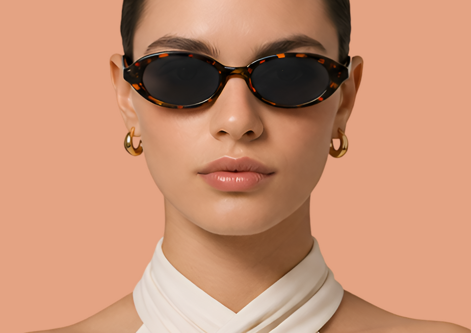 DressYourMind Eyewear turtoise oval shaped framed retro sunglasses on an elegant female fashion model with blonde hairs, premium vintage-inspired eyewear with UV400 lenses