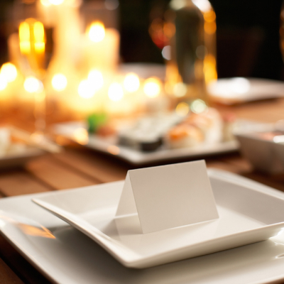 Elegant dinner table setting with blank place card